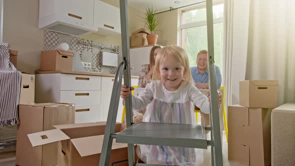 Active Family Group Move in Rent Real Estate. Positive Looking at Relocating or Unpacking of Carton alt