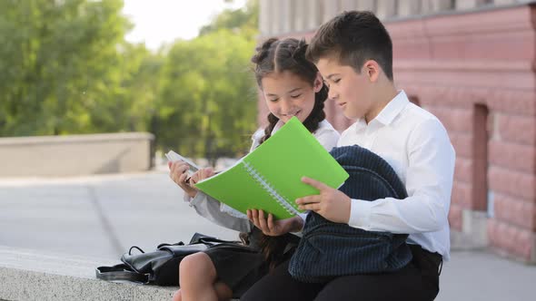 Two Children Schoolchildren Students Pupils Little Girl and Small Boy Brother and Sister Classmates alt