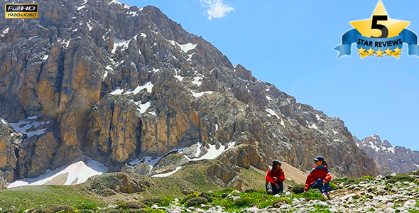 Young girls on the mountain peak alt