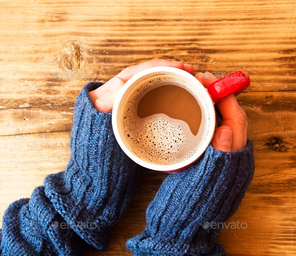 Warm Hands Holding Chocolate Cup