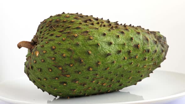 Closeup of Green Soursop Graviola, Exotic, Tropical Fruit Guanabana on Plate alt