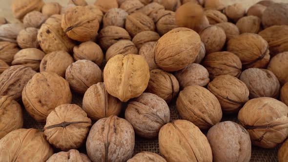 Walnuts on burlap. Shooting with a slider. alt