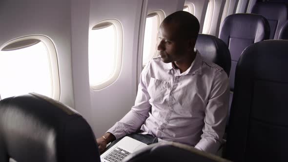 Man resting on airplane flight
