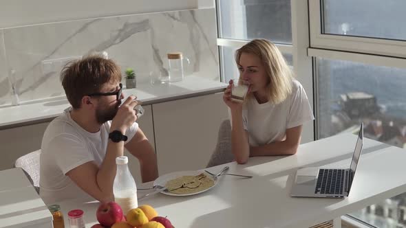 High Angle View of Couple Smiling with Joy at Good Morning in Modern Kitchen Affectionate Young alt