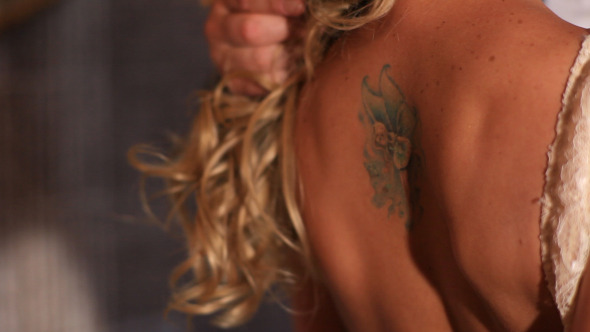 Tattoo On Back Of A Beautiful Blonde Hair Woman