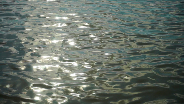 River Surface With Small Ripples  At Sunset