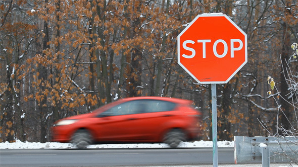 Stop Road Sign and Traffic Cars