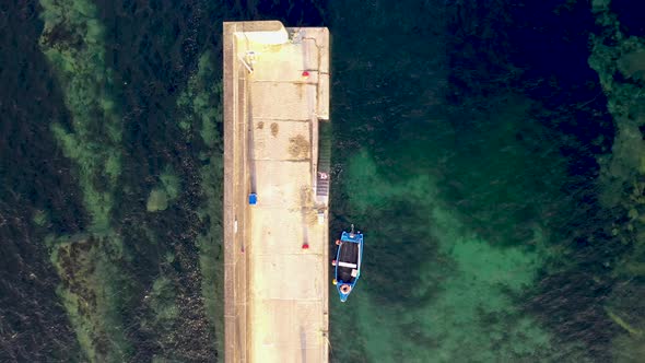 Having a Swim at the Pier of Portnoo Harbour in County Donegal Ireland alt