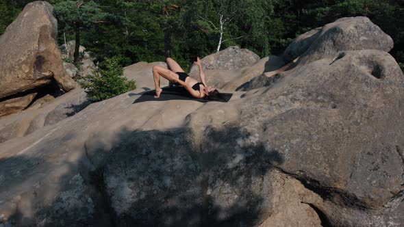 Pretty Woman Lies on Mat Raises Her Pelvis Body Hands alt