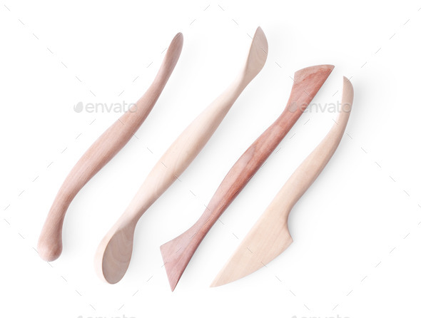artists sculpting wooden tools isolated on white background
