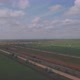 Aerial view of wind turbines energy production and road on fields - VideoHive Item for Sale
