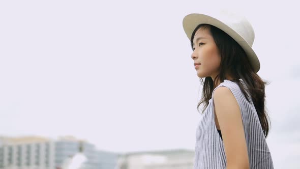 Beautiful Asian girl using smartphone at community mall.