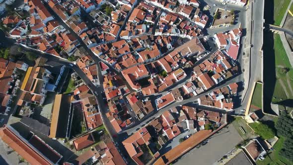 Aerial View of Elvas Cityscape with Brownish Tiled Roofs White Buildings in Sunny Day Portugal