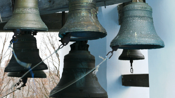 Bell Ringer Plays Church Bells at Belfry