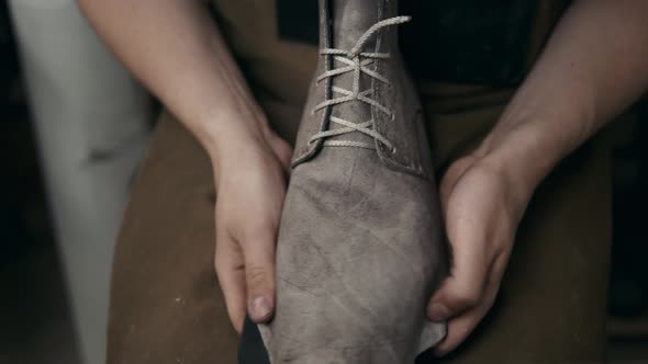 Shoemaker Makes Leather Shoes for Men Sole of Shoe Handmade Craft DIY Process Craftsman Making Boots alt