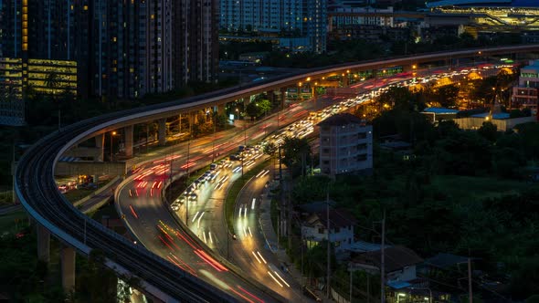 Highway interchange junction and traffic during rush hour in Bangkok, at night - time lapse