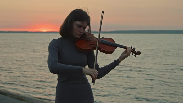 Woman Musician Is Playing Violin With Inspiration
