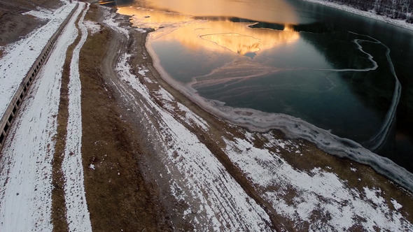 Partially Iced Lake at Sunset 