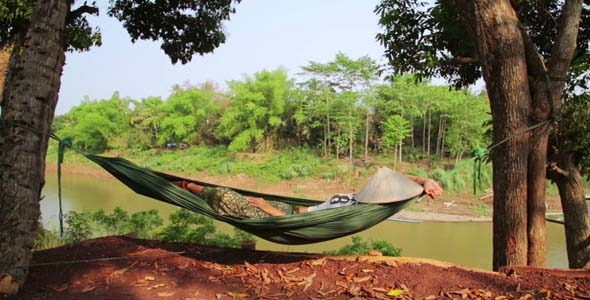 Tourist Girl Sleeping On Hammock, Laos 1