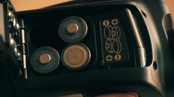 Putting in the AA batteries alt