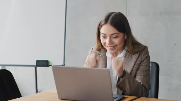 Caucasian Young Business Woman Girl Student Working at Computer Sitting in Office at Table Uses alt