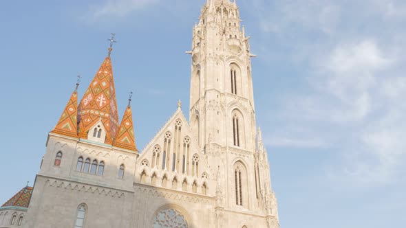 Matthias Church tower on Buda side of Budapest against blue sky 4K 2160p UltraHD footage  - Matyas-t alt