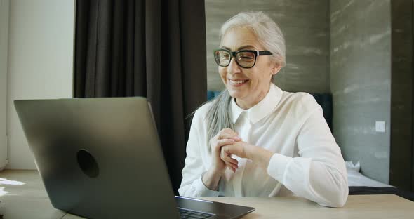 Woman Having Video Chat on Laptop