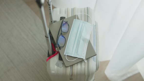 Packing suitcase getting ready for road trip preparing luggage.