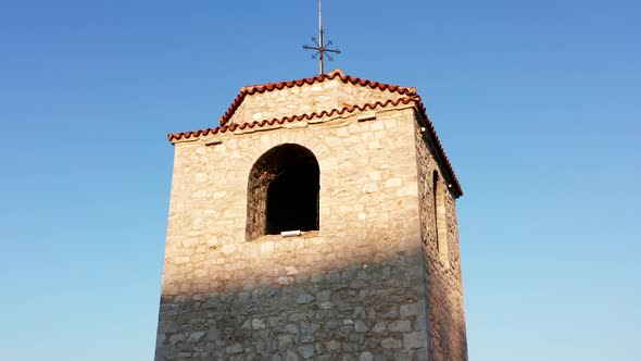 Old watchtower made of stone - tall medieval building. Observation deck - viewing platform alt