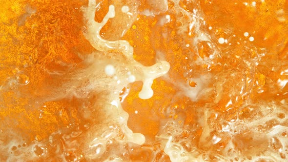 Super Slow Motion Shot of Rippling Fresh Beer Wave From Top Shot at 1000Fps alt