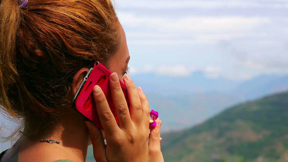 Female Tourist Using Mobile Phone at Mountain 3
