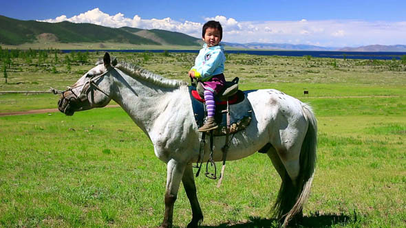 Young Baby Girl On Horseback In Steppe 2