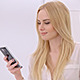 Young Blond Girl Using Mobile Phone - VideoHive Item for Sale