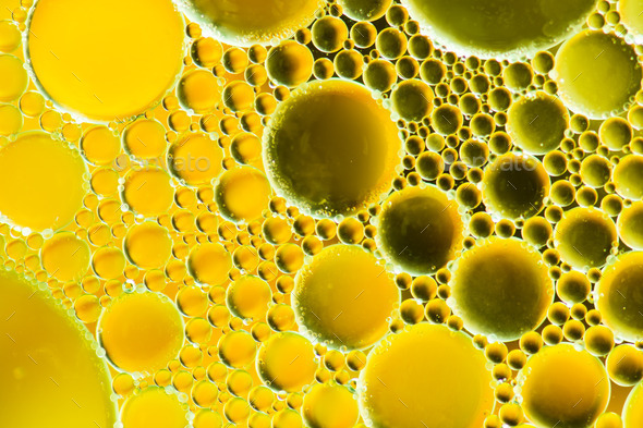 Close Up of a Drop Oil on a Yellow Background Stock Image - Image