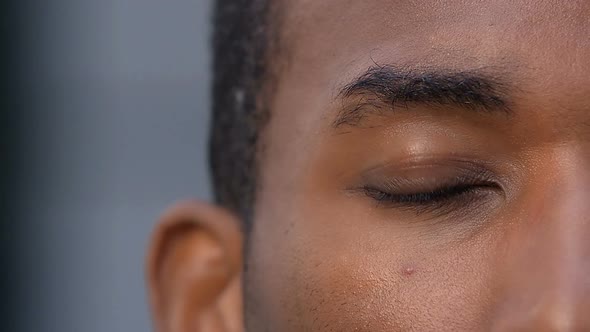 black American-African businessman opens his eye alt