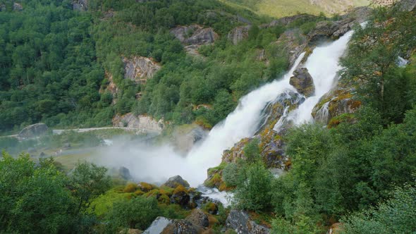 Beautiful Waterfall From the Meltwater of the Brixdal Glacier in Norway, Top View alt