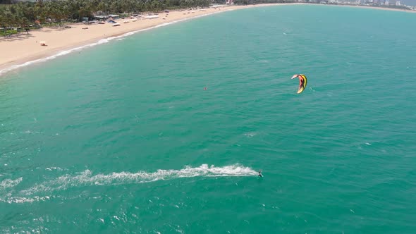 Acrobatic Jump of Professional Kite Surfer on the Sea Wave, Athlete Showing Sport Trick Jumping alt