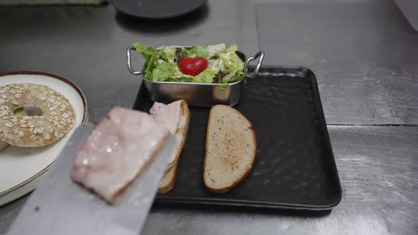 Preparing Traditional English Breakfast, Restaurant Chef in Black Gloves alt