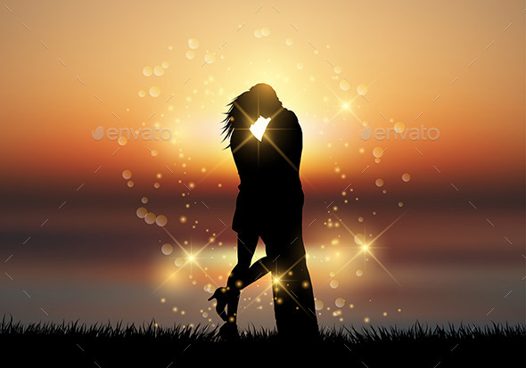 Kissing Couple Against a Sunset Sky - Valentines Seasons/Holidays