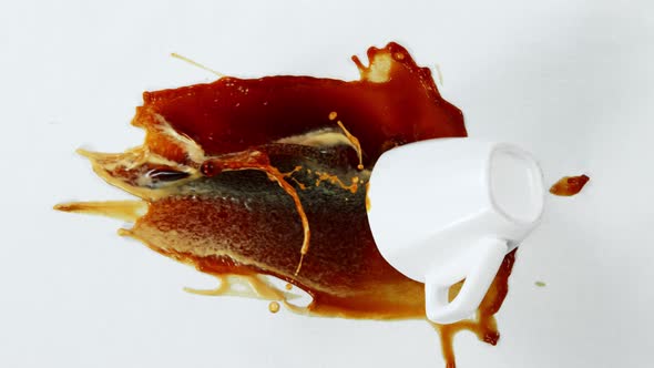 Super Slow Motion Shot of Spilling Coffee on White Cloth at 1000Fps. alt