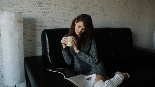 Woman Reading Magazine And Drinking Coffee