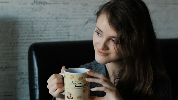 Beautiful Woman In Drinking Coffee