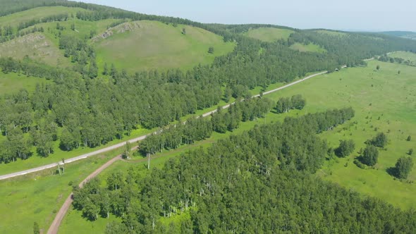 Aerial View of Green Fields and Road
