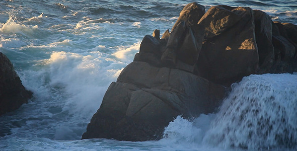 Wave Crashes on Large Ocean Rock