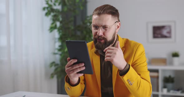 Businessman Using Tablet for Video Call
