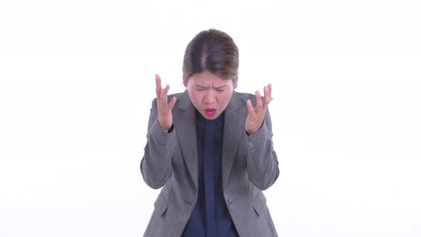 Stressed Young Asian Businesswoman Getting Bad News alt
