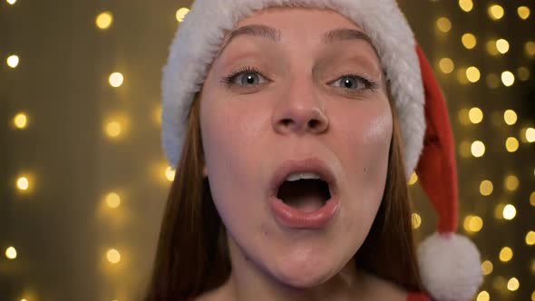 Close Up Shocked Woman with Santa Christmas