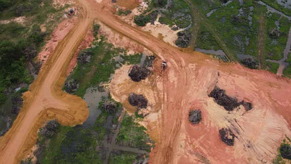 Aerial rotate look down the land clearing of oil palm plantation alt