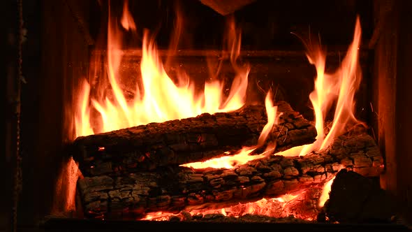 Warm Cozy Burning Fire in a Brick Fireplace Closeup Shot