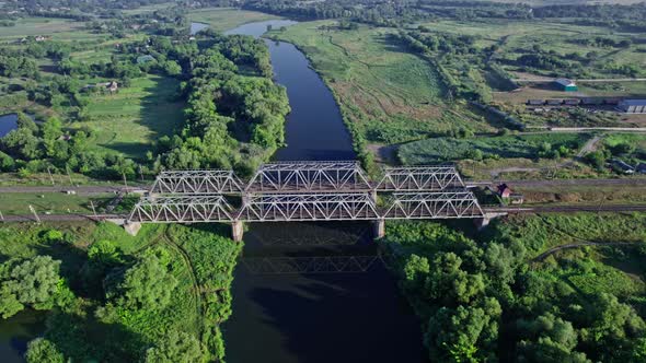 Railway Bridge Crossing a Beautiful Valley During the Summer Season alt